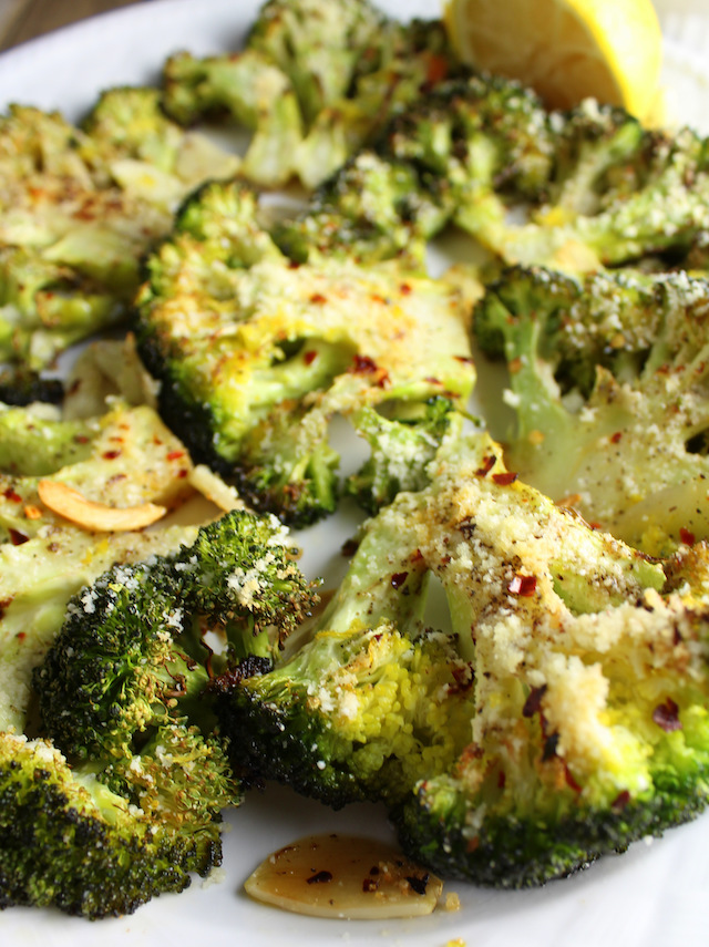 Eye level close up partial platter of roasted broccoli 