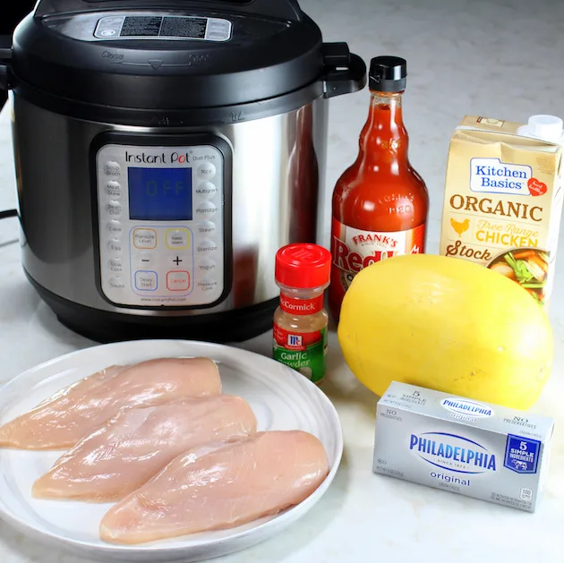 ingredients for buffalo chicken in front of an instant pot