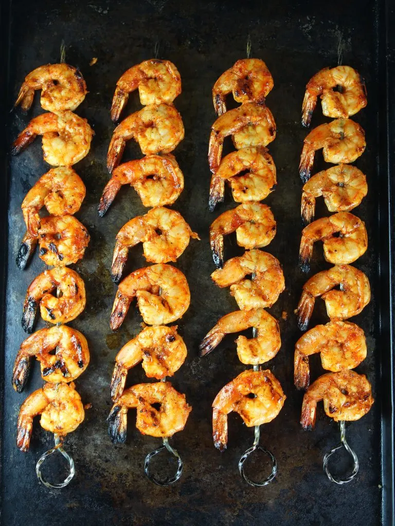 grilled gulf shrimp skewers on baking sheet after grilling